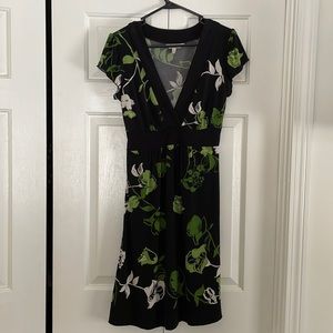 Green and black floral knee length dress